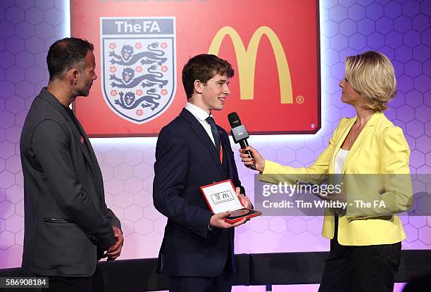 Jacqui Oatley and Ryan Giggs on stage with the winner of the Young Volenteer of the Year Award, Peter Harding at the McDonalds Community Awards at...