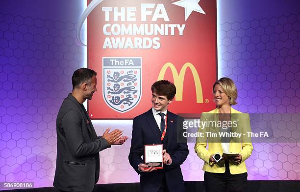 Jacqui Oatley and Ryan Giggs on stage with the winner of the Young Volenteer of the Year Award, Peter Harding at the McDonalds Community Awards at...