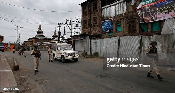 Men patrol during the curfew hours on August 7, 2016 in Srinagar, India. Kashmir has been reeling under violence, curfew and separatists called...