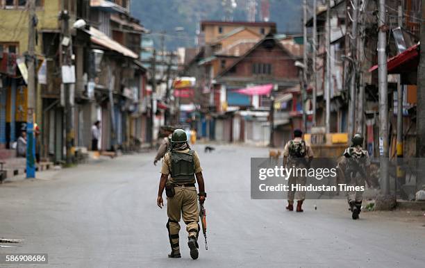 Men patrol during the curfew hours on August 7, 2016 in Srinagar, India. Kashmir has been reeling under violence, curfew and separatists called...