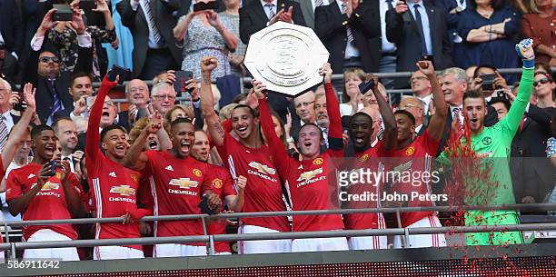 Wayne Rooney of Manchester United lifts the Community Shield trophy after the FA Community Shield match between Leicester City and Manchester United...