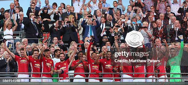 Wayne Rooney of Manchester United lifts the Community Shield trophy after the FA Community Shield match between Leicester City and Manchester United...