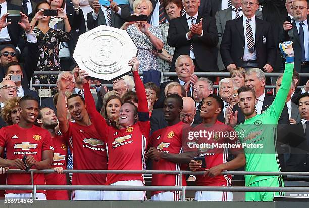 Wayne Rooney of Manchester United lifts the Community Shield trophy after the FA Community Shield match between Leicester City and Manchester United...