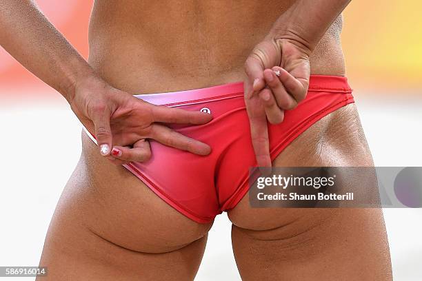 Heather Bansley of Canada signals during the Women's Beach Volleyball preliminary round Pool E match against Sophie van Gestel and Jantine van der...