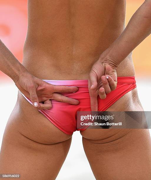 Heather Bansley of Canada signals during the Women's Beach Volleyball preliminary round Pool E match against Sophie van Gestel and Jantine van der...