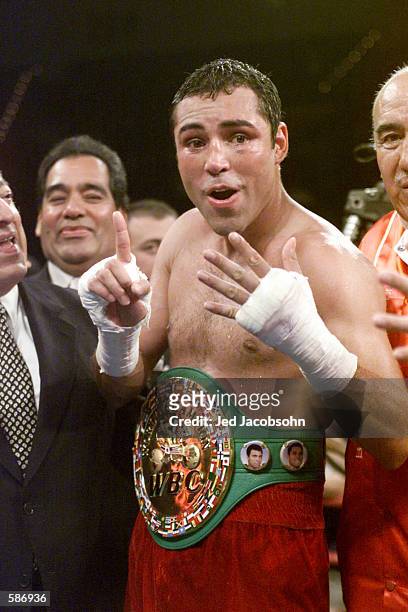 Oscar De La Hoya poses with his belt after defeating Javier Castillejo during the WBC Super Welterweight Championship bout at the MGM Grand Hotel &...
