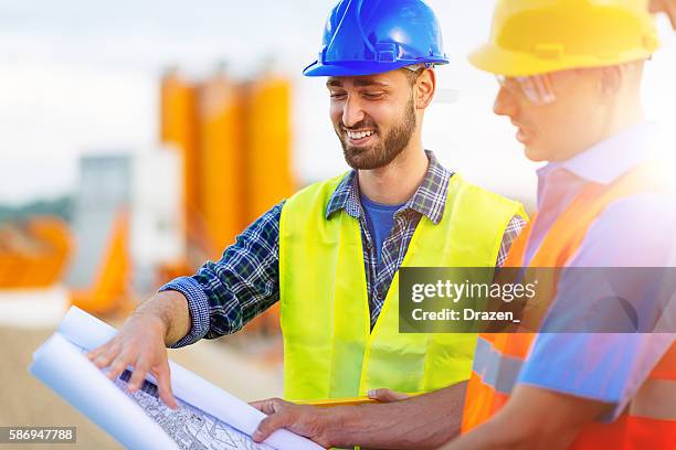 image of mining engineers with project draft - underjordsgruva bildbanksfoton och bilder