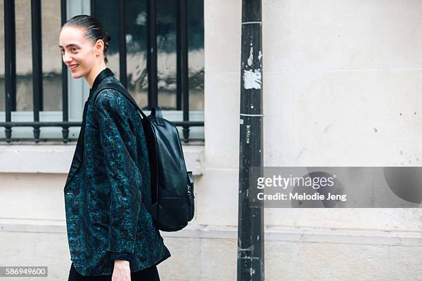 Russian model Lia Pavlova wears a dark green jacket and Rag & Bone black leather backpack after the Francesco Scognamiglio couture show on Day 1 of...