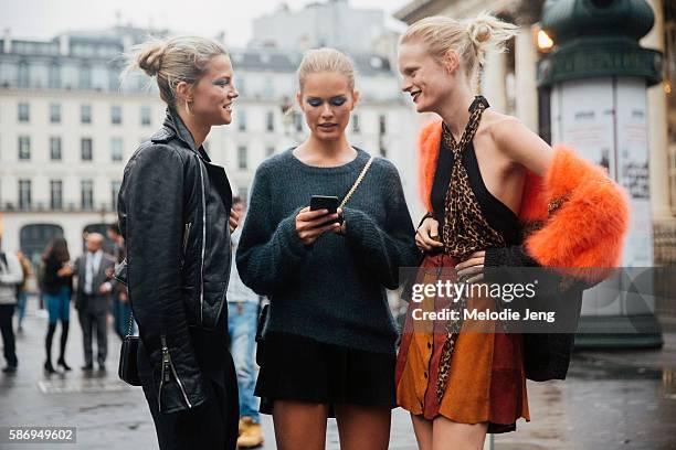 Models Kasia Struss, Anna Ewers, Hanne Gaby Odiele call and Uber after the Atelier Versace show on Day 1 of Couture FW 16 on July 03, 2016 in Paris,...