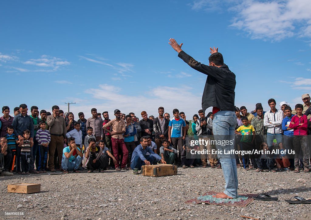 Man Walking On Broken Glass During A Show On A Market, Hormozgan, Minab, Iran