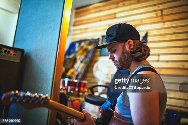 icelander man playing the guitar - micrófono de condensador fotografías e imágenes de stock