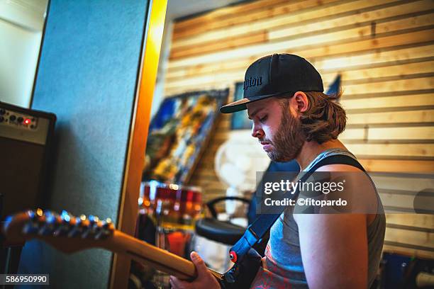 icelander man playing the guitar - folk music stock pictures, royalty-free photos & images