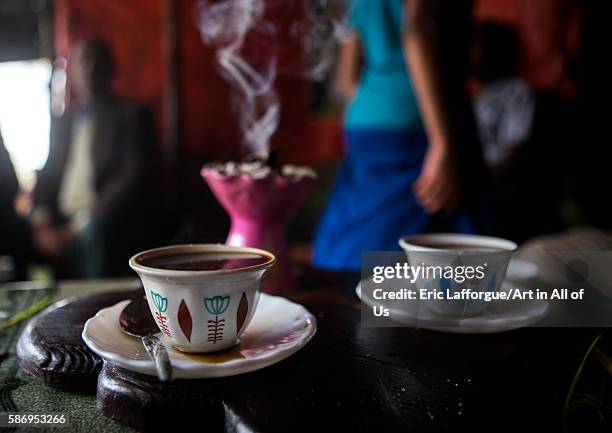 Ethiopian traditional coffee ceremony with incense burning on charcoal, semien wollo zone, woldia, Ethiopia on February 24, 2016 in Woldia, Ethiopia.