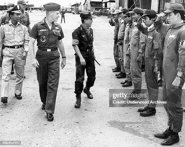 Air Force 3rd Tactical Fighter Wing Commander Colonel Robert Ackerly escorts Republic of Vietnam Chief of State Nguyen Van Thieu on an inspection...