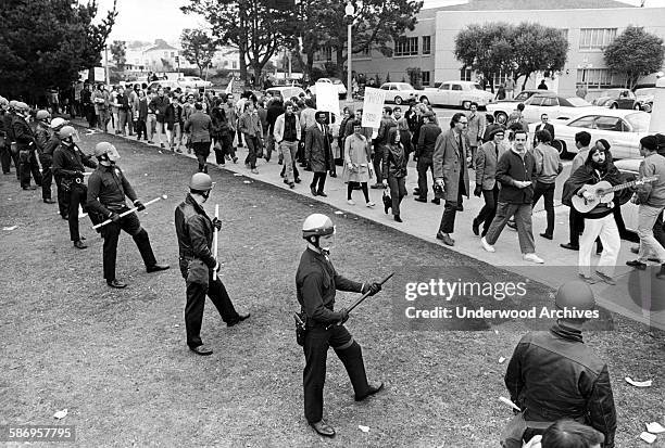 Riot police establish a line during the San Francisco State University student strike demonstration and subsequent riots, San Francisco, California,...