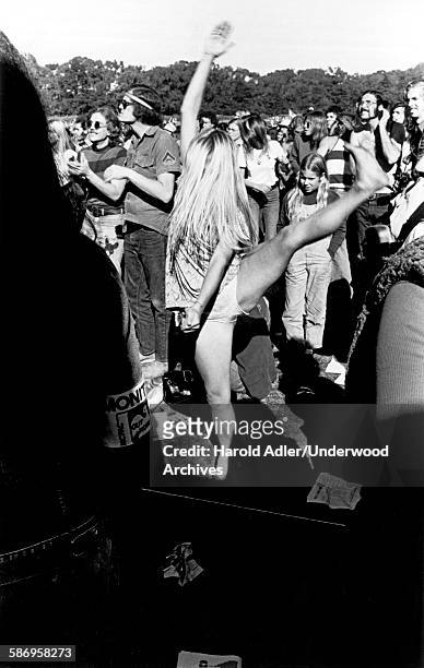 Woman dances at an anti-Vietnam War demonstration in Golden Gate Park, San Francisco, California, late 1960s.