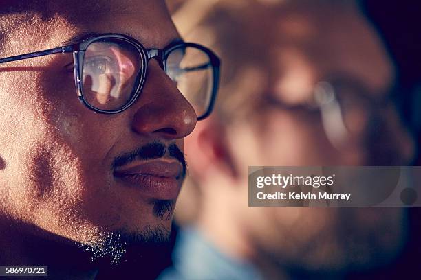 close up of mixed race male professional - office concentration stock pictures, royalty-free photos & images