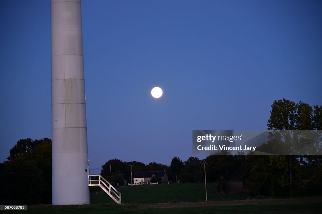 Moon with wind turbine in France