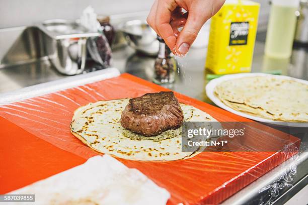 preparing beef wellington - beef wellington foto e immagini stock