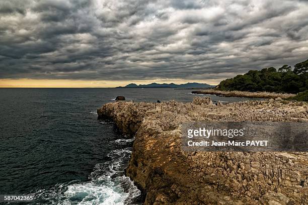 seascape and sunset with cloudy sky - jean marc payet stock-fotos und bilder