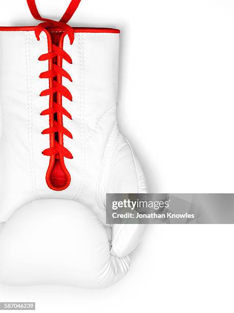 white boxing glove with red laces on white - boxing gloves isolated stock-fotos und bilder