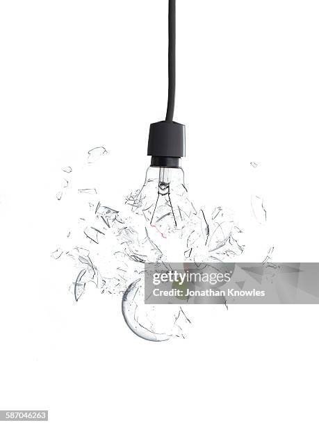 exploding light bulb - broken lamp stockfoto's en -beelden