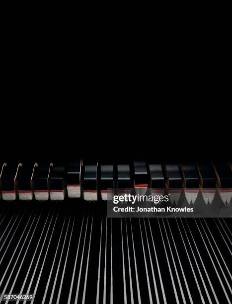 close up of piano with strings - klavier stock-fotos und bilder