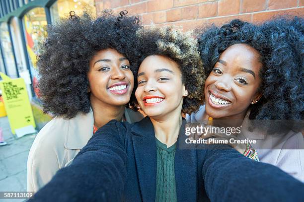 selfie of three young friends. - woman selfie stockfoto's en -beelden