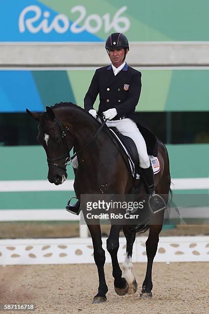 Phillip Dutton of the United States riding Mighty Nice competes in the Eventing Team Dressage event during equestrian on Day 2 of the Rio 2016...