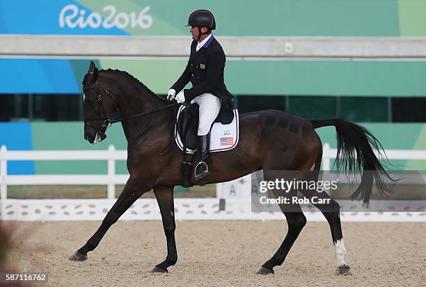 Phillip Dutton of the United States riding Mighty Nice competes in the Eventing Team Dressage event during equestrian on Day 2 of the Rio 2016...