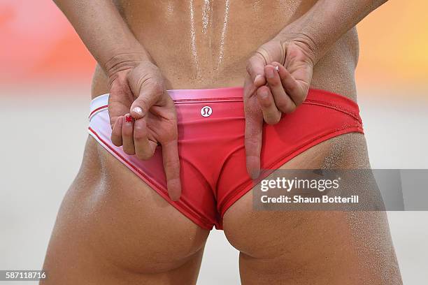 Heather Bansley of Canada signals during the Women's Beach Volleyball preliminary round Pool E match against Sophie van Gestel and Jantine van der...