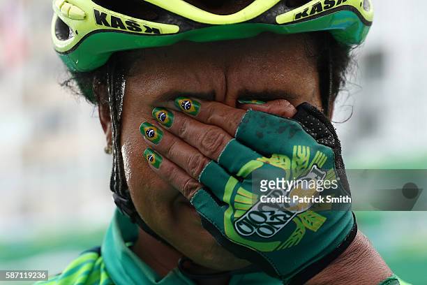 Clemilda Fernandes Silva of Brazil reacts after finishing the Women's Road Race on Day 2 of the Rio 2016 Olympic Games at Fort Copacabana on August...