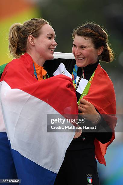 Gold medalist Anna van der Breggen of the Netherlands and silver medalist Emma Johansson of Sweden celebrate on the podium following the Women's Road...