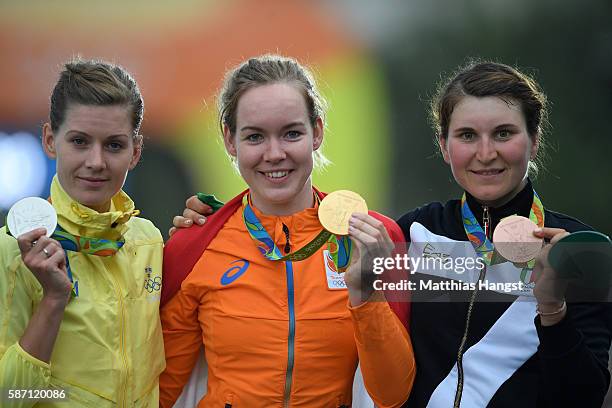 Silver medalist Emma Johansson of Sweden, gold medalist Anna van der Breggen of the Netherlands and bronze medalist Elisa Longo Borghini of Italy...