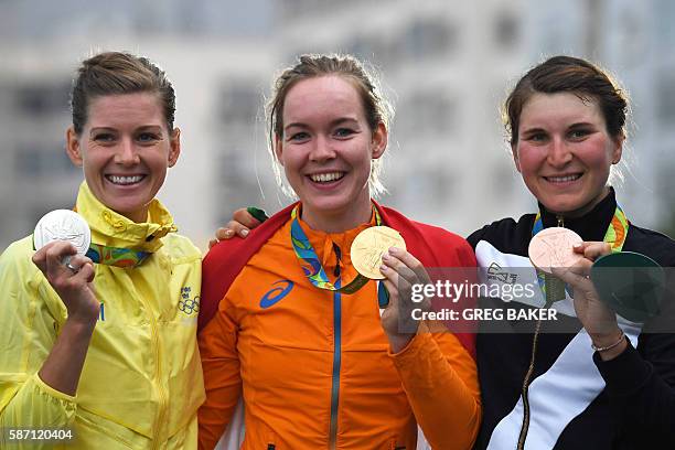 Silver medallist Sweden's Emma Johansson, Gold medallist Netherlands' Anna Van Der Breggen and Bronze Italy's Elisa Longo Borghini pose on the podium...