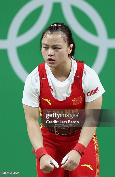 Yajun Li of China reacts after failing to lift during the Women's 53kg Group A weightlifting contest on Day 2 of the Rio 2016 Olympic Games at...