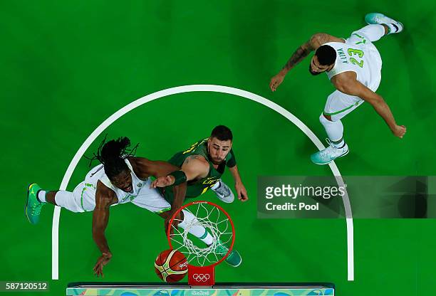 Nene Hilario of Brazil shoots against Antanas Kavaliauskas of Lithuania during a Men's preliminary round basketball game between Brazil and Lithuania...