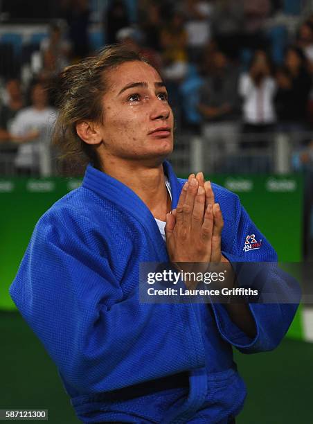 Majlinda Kelmendi of Kosovo shows her emotions as she celebrates winning the gold medal against Odette Giuffrida of Italy during the Womens -52kg...