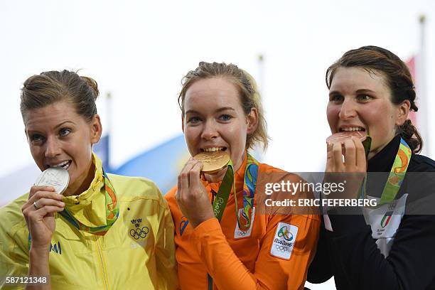 Silver medallist Sweden's Emma Johansson, Gold medallist Netherlands' Anna Van Der Breggen and Bronze medallist Italy's Elisa Longo Borghini pose on...