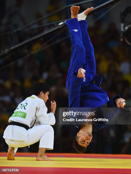 Fabio Basile of Italy performs a flip as he celebrates winning the gold medal against Baul An of Korea during the Men's -66kg gold medal final on Day...