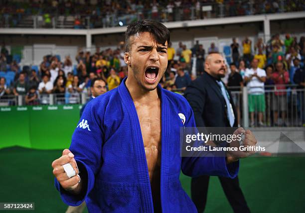 Fabio Basile of Italy celebrates winning the gold medal against Baul An of Korea during the Men's -66kg gold medal final on Day 2 of the Rio 2016...
