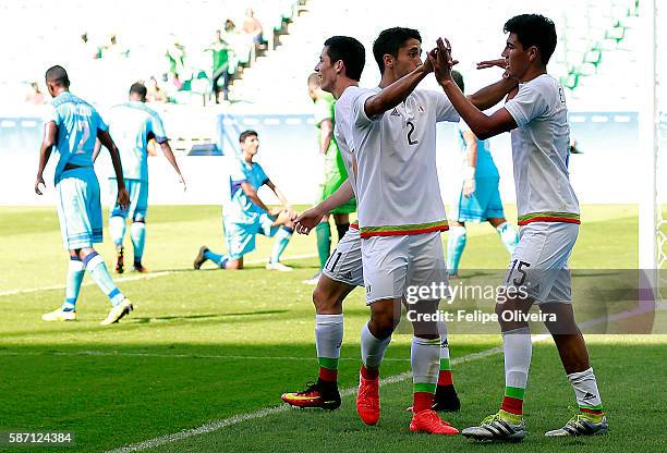 Jose Abella of Mexico celebrates with teammate Michael Perez during the Men's First Round Group C match between Fiji and Mexico at Arena Fonte Nova...