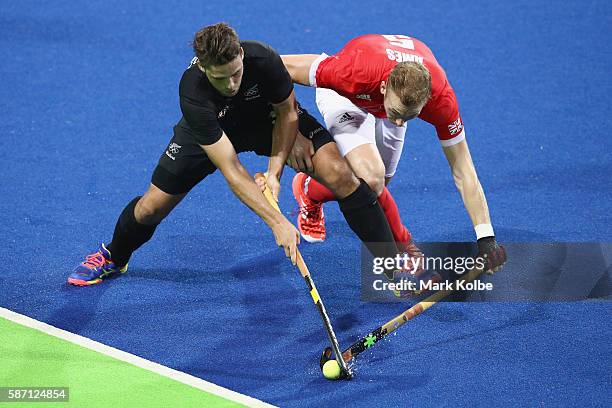 Nick Wilson of New Zealand and David Ames of Great Britain compete for the ball during the men's pool A match between Great Britain and New Zealand...