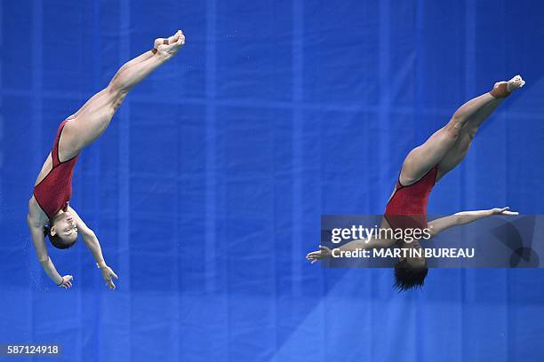 China's Wu Minxia and China's Shi Tingmao compete in the Women's Synchronized 3m Springboard Final during the diving event at the Rio 2016 Olympic...