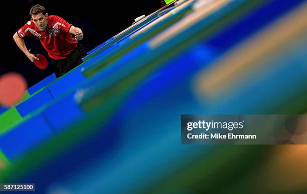 Robert Gardos of Austria plays a Men's Singles second round match against Ovidiu Ionescu of Romania on Day 2 of the Rio 2016 Olympic Games at...