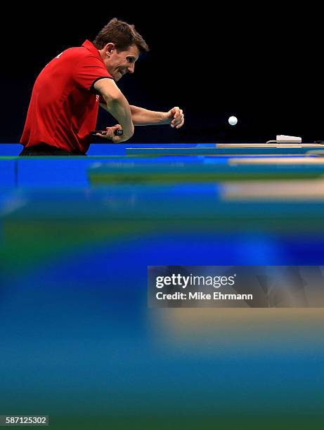 Robert Gardos of Austria plays a Men's Singles second round match against Ovidiu Ionescu of Romania on Day 2 of the Rio 2016 Olympic Games at...