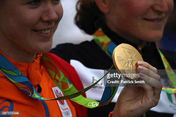 Gold medalist Anna van der Breggen of the Netherlands celebrates after winning the Women's Road Race on Day 2 of the Rio 2016 Olympic Games at Fort...