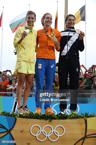 Silver medalist Emma Johansson of Sweden, gold medalist Anna van der Breggen of the Netherlands and bronze medalist Elisa Longo Borghini of Italy...