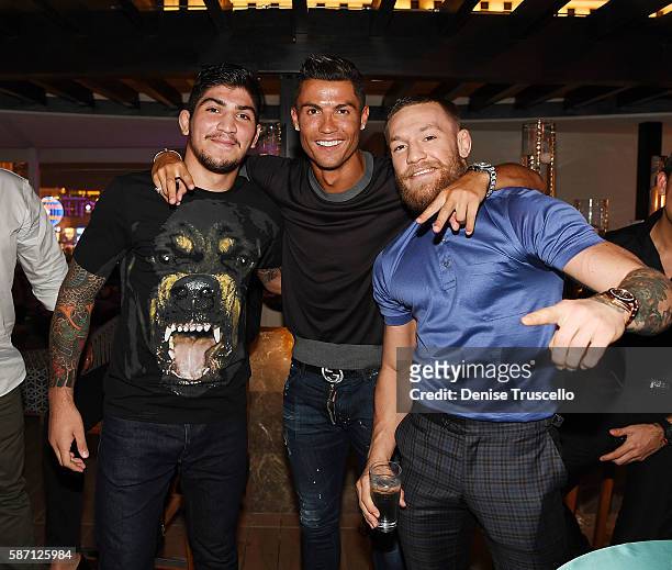 Dillon Danis, Cristiano Ronaldo and Connor McGregor attend Jennifer Lopez's birthday at Nobu Villa Atop Nobu Hotel at Caesars Palace on July 24, 2016...