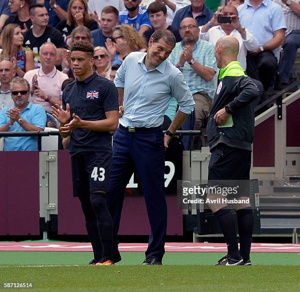 Marcus Browne of West Ham United waits to come on whilst Slaven Bilic laughs with the Fourth Official at London Stadium on Queen Elizabeth Olympic...